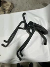 Used Mercruiser Thermostat Housing With Hoses Part # 79468A1. Fixed Price $200.00.